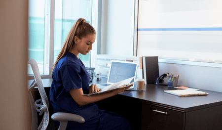 Hospital staff examines their medical marketing results in their office